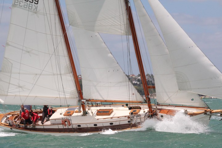 Group of people onboard on a boat with massive waves