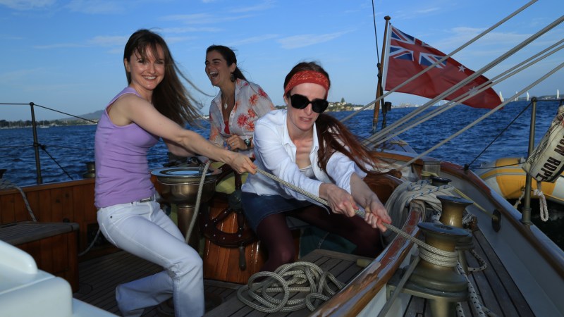 3 girls having a good time on a boat