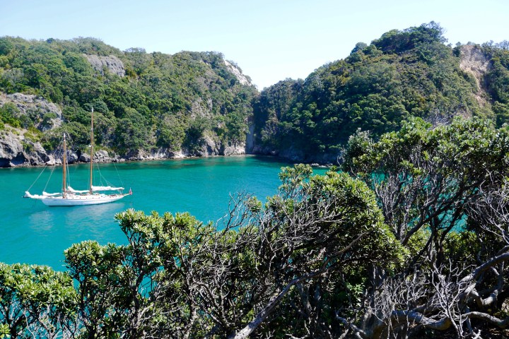 White classic boat cruising on the beautiful island